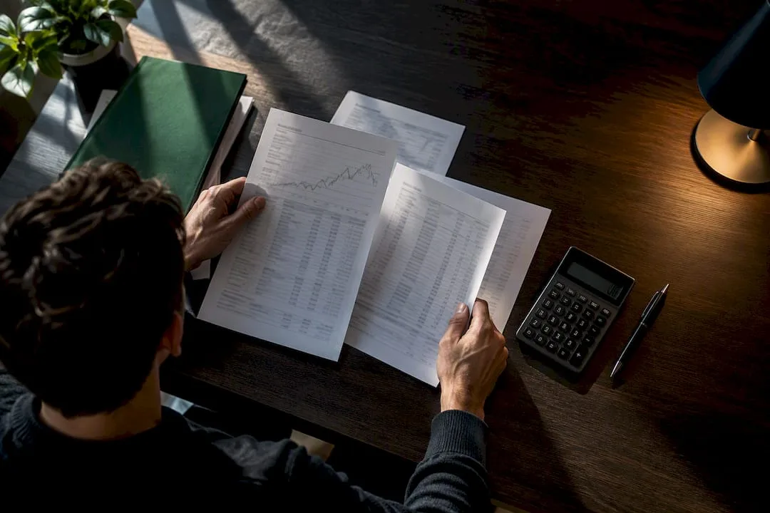 Trader organizing forex tax records